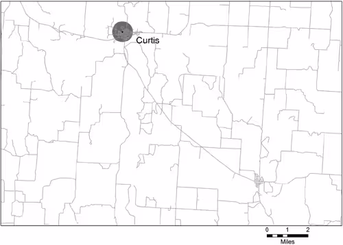 This figure is a map of a portion of Frontier County, Nebraska, and the city of Curtis; the map shows the location of the only school within the approximately 160-square-mile area illustrated. Around the school location is a circle with a one-half mile radius.