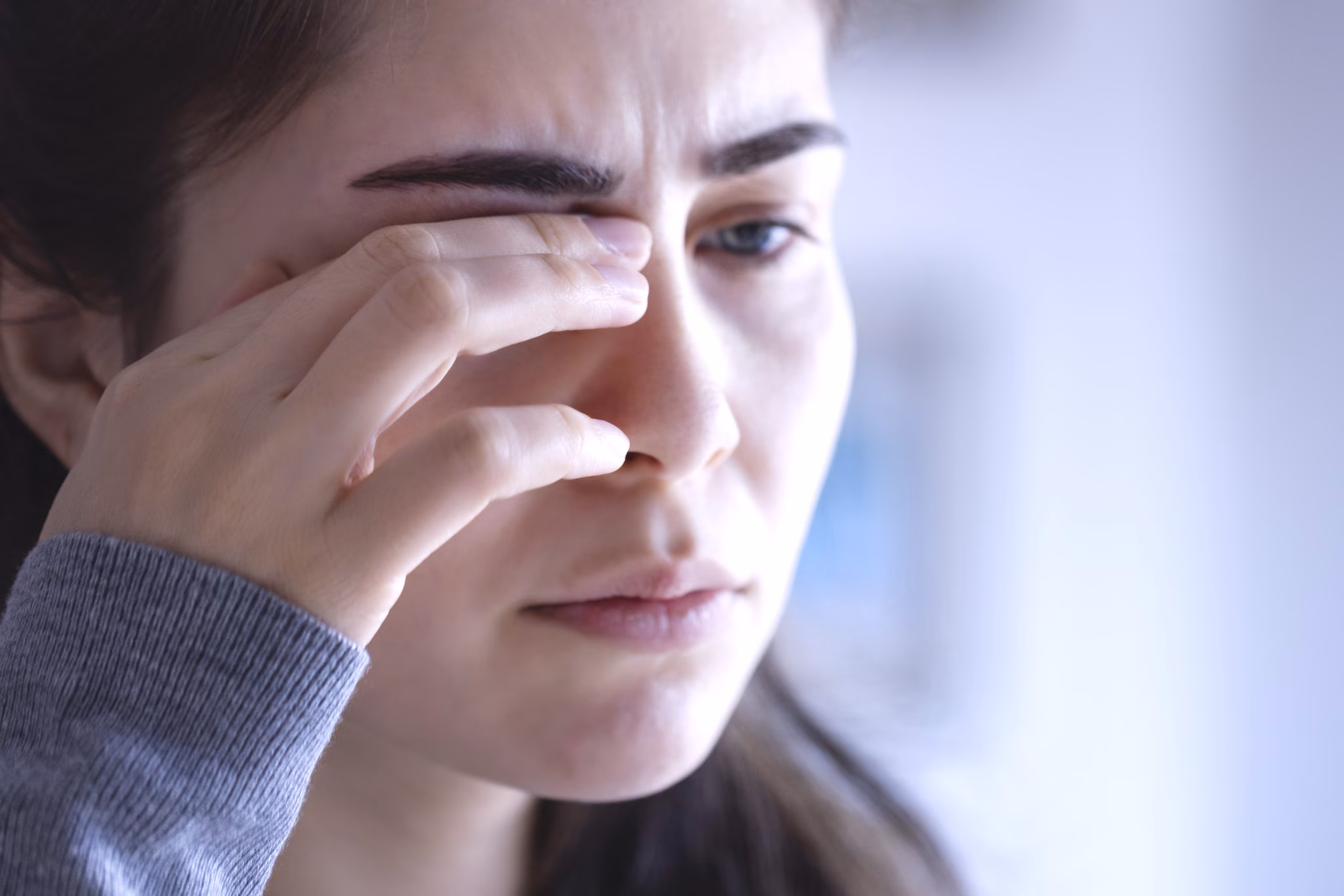 Woman rubbing her eye