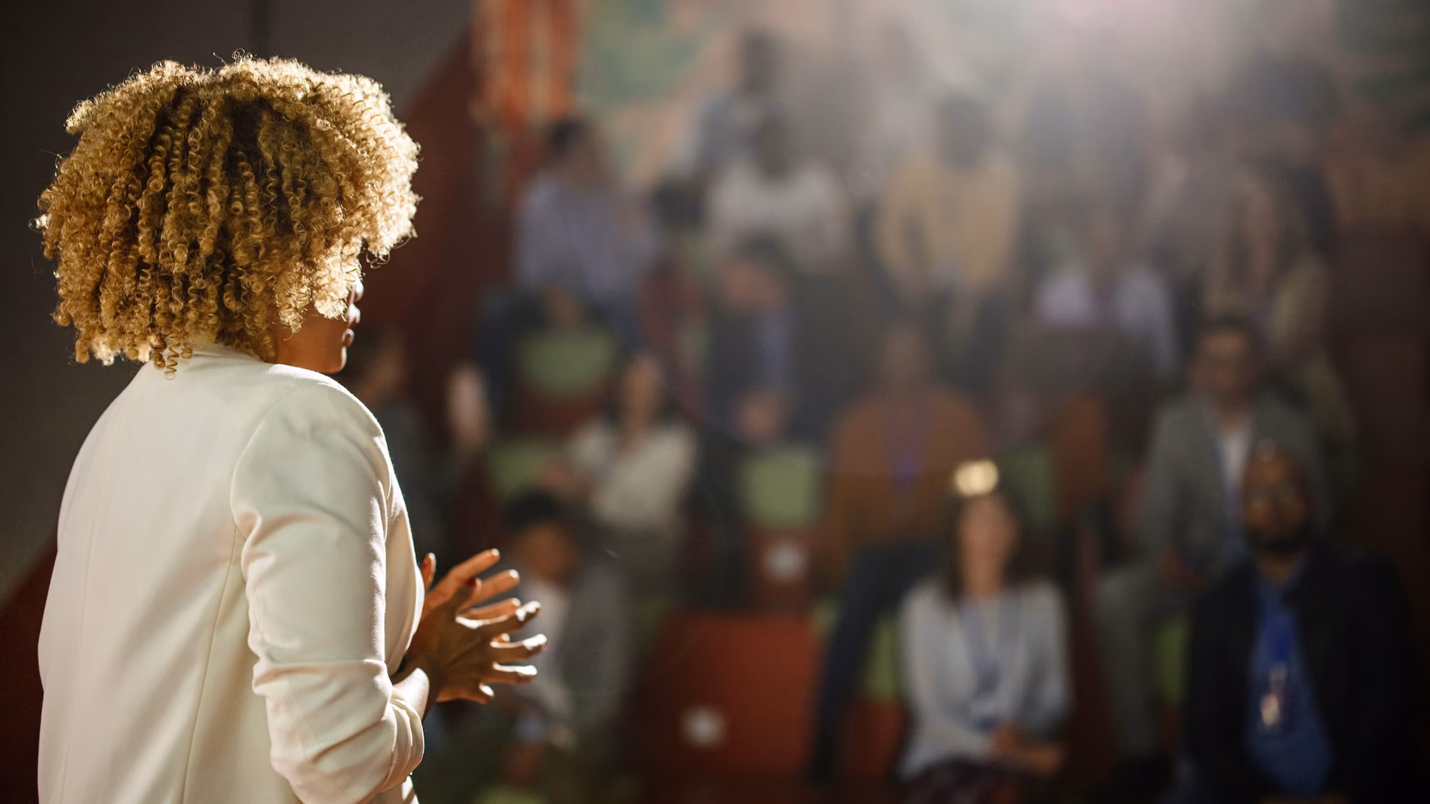 Woman presenting in front of audience