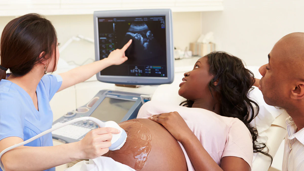 Doctor performing ultrasound on pregnant woman Doctor performing ultrasound on pregnant woman