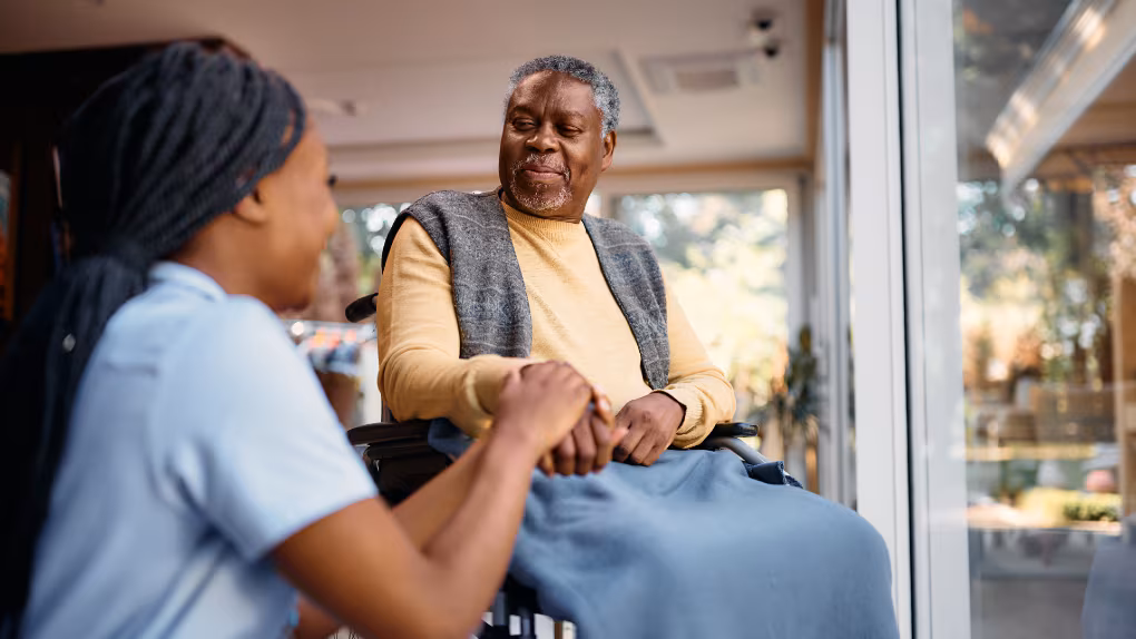 — title missing — Community health worker with a client in his home
