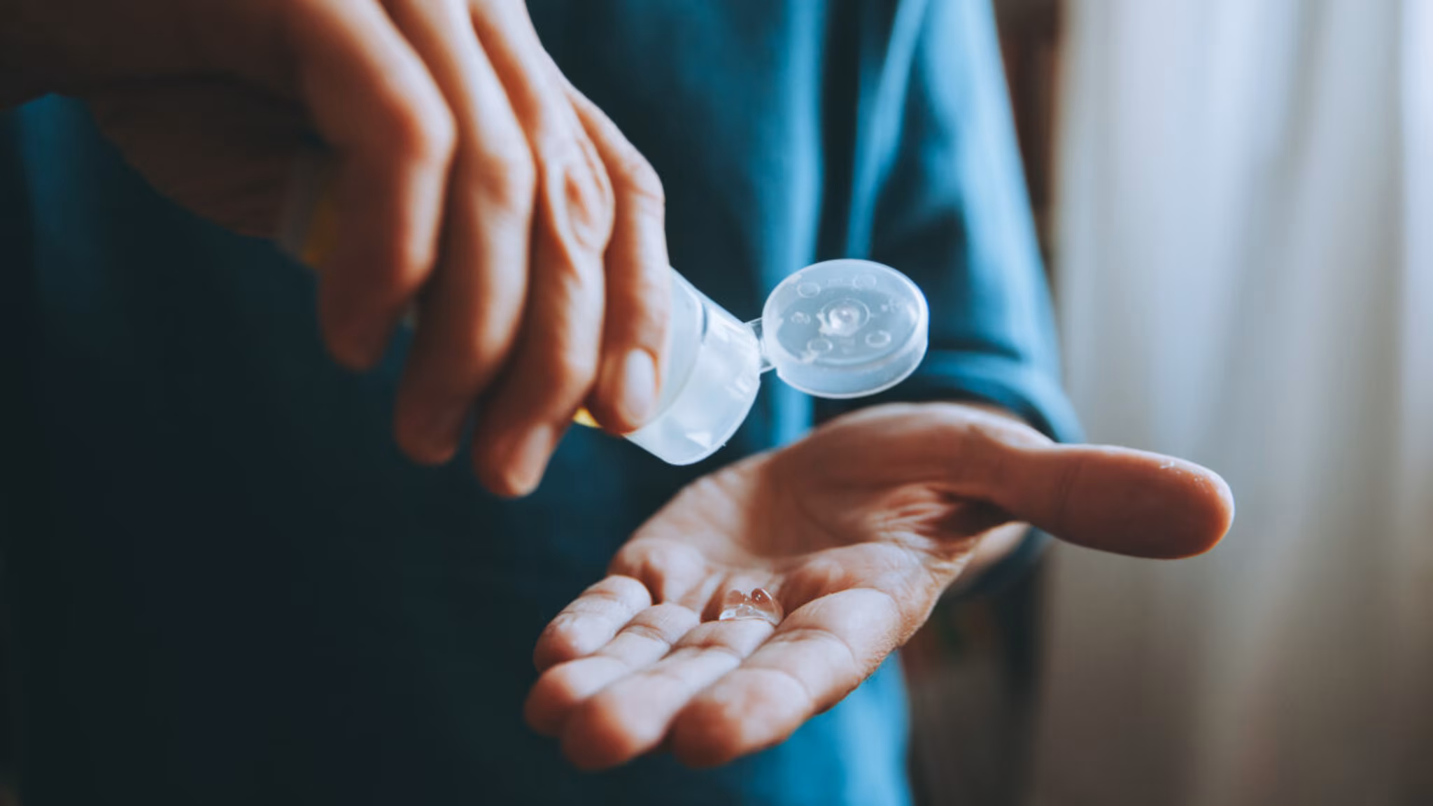 Person using hand sanitizer
