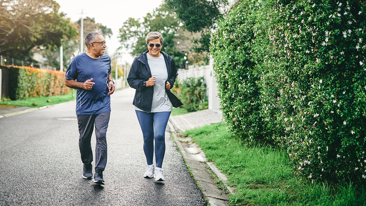 Full length shot of a senior couple bonding together while running outdoors Full length shot of a senior couple bonding together while running outdoors