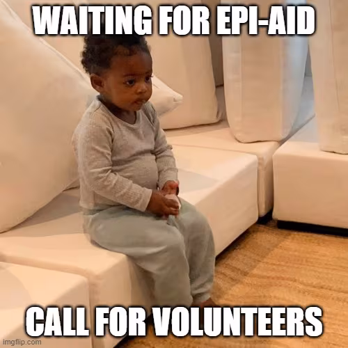 toddler-girl-waiting-meme a small child sits on a sofa with hands folded in lap. Text reads: Waiting for Epi-Aid call for volunteers