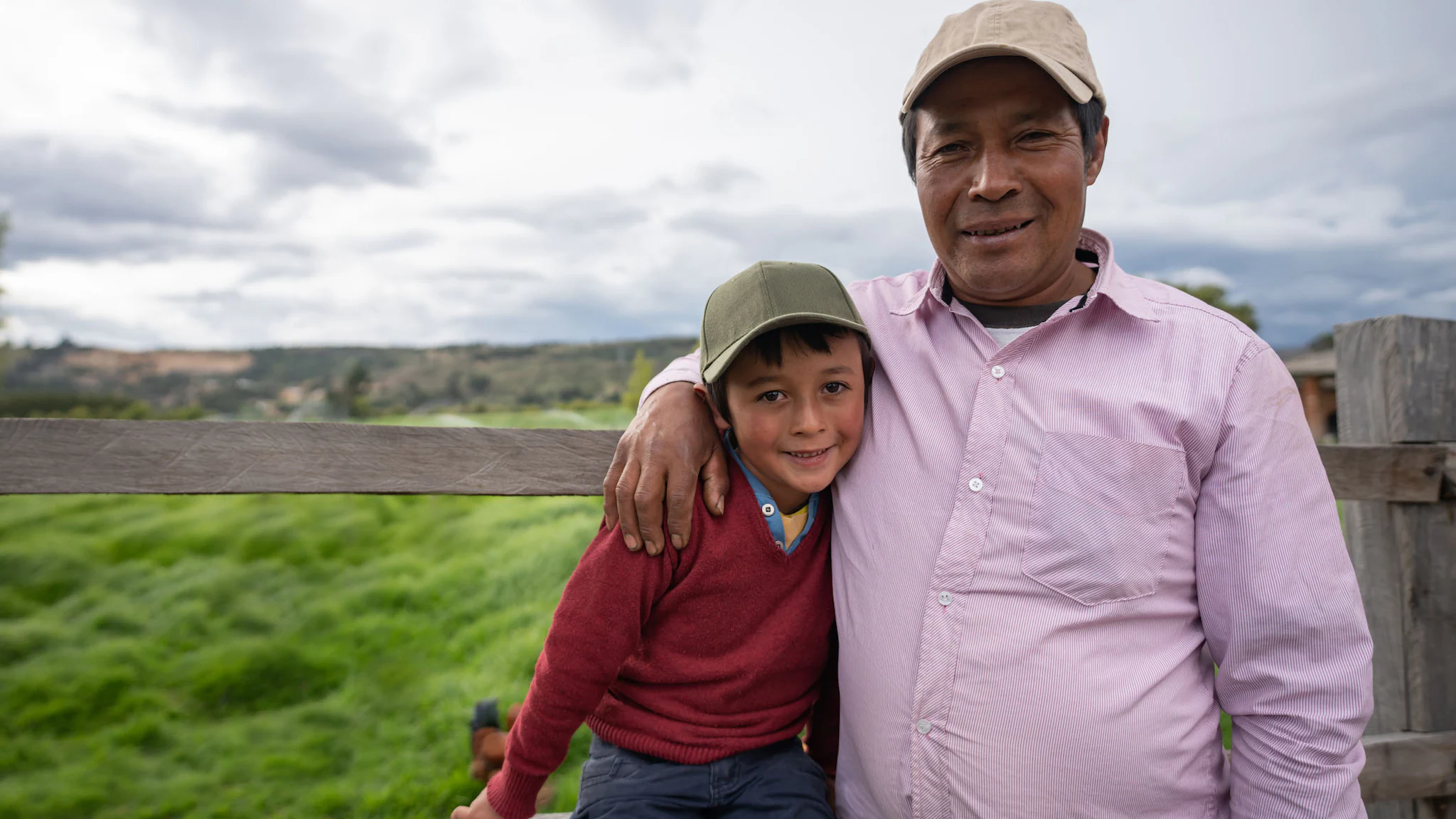 Loving father and son looking happy at a farm Loving father and son looking happy at a farm.