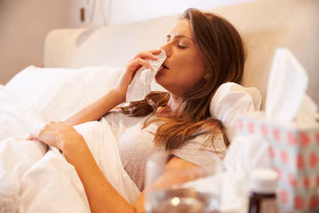 Woman in bed with flu