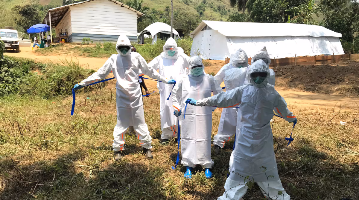 Ebola DRC PPE Five public health workers dressed in personal protective equipment during the Ebola response in Congo.