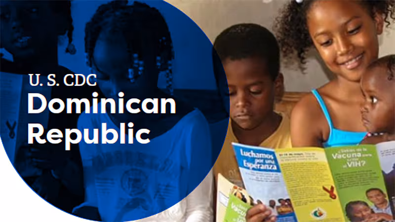 Children in the Dominican Republic reading CDC health brochures on vaccines and HIV.