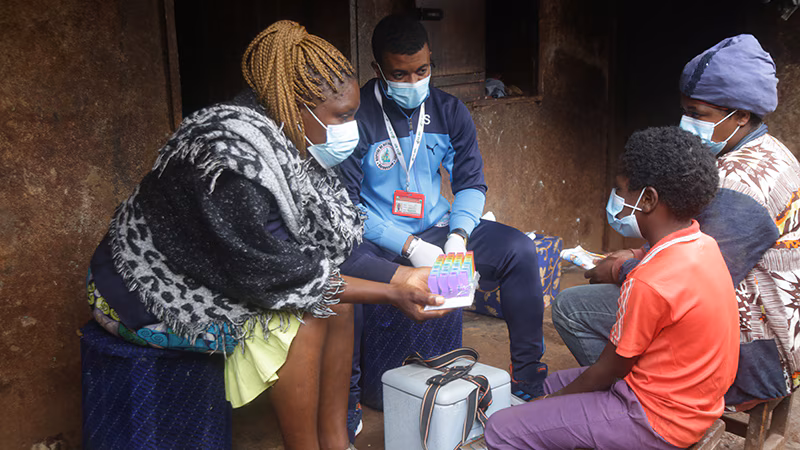 Photo of people living with HIV receiving care during worldwide public health emergency.