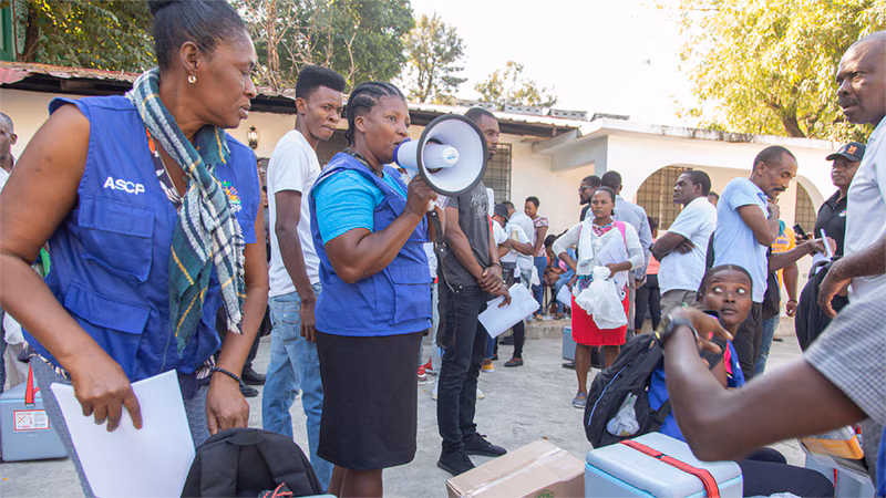 Cholera Response Work in Haiti_004 Community health workers in Haiti educate residents on cholera prevention and hygiene practices.