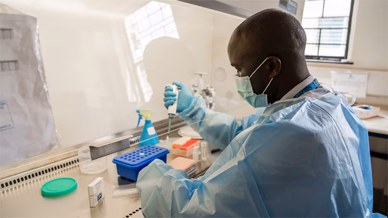 man testing samples in a lab