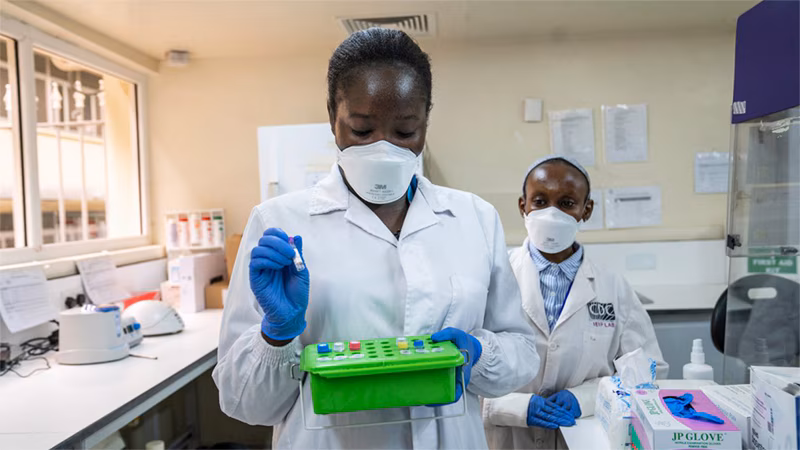 two women in a Kenya lab processing COVID-19 tests