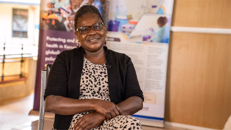 photo of a woman sitting and smiling
