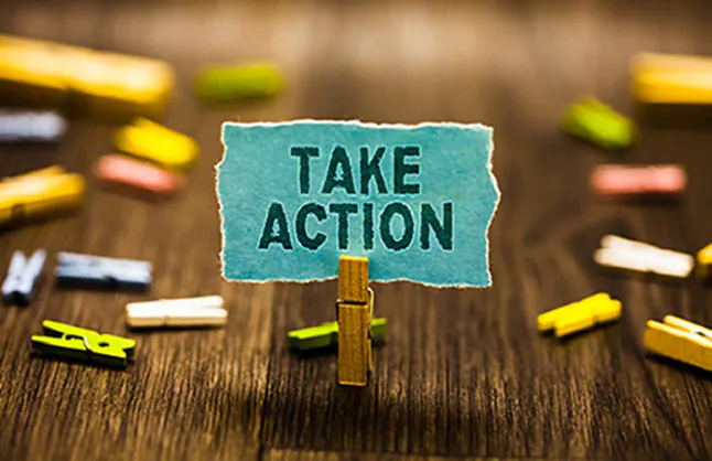 Take Action sign that reads 'take action'