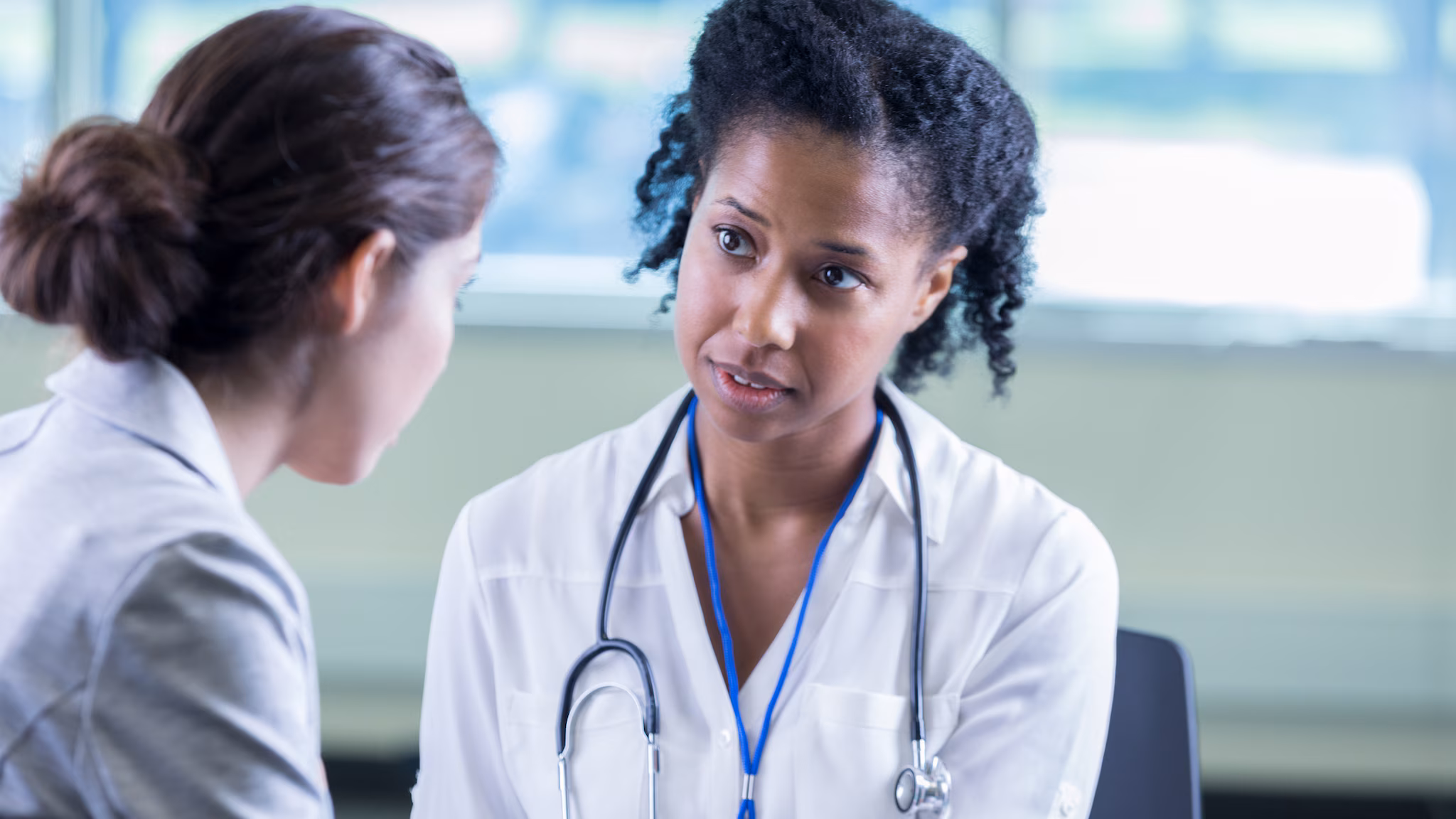 doctor and patient A female doctor talks to a patient