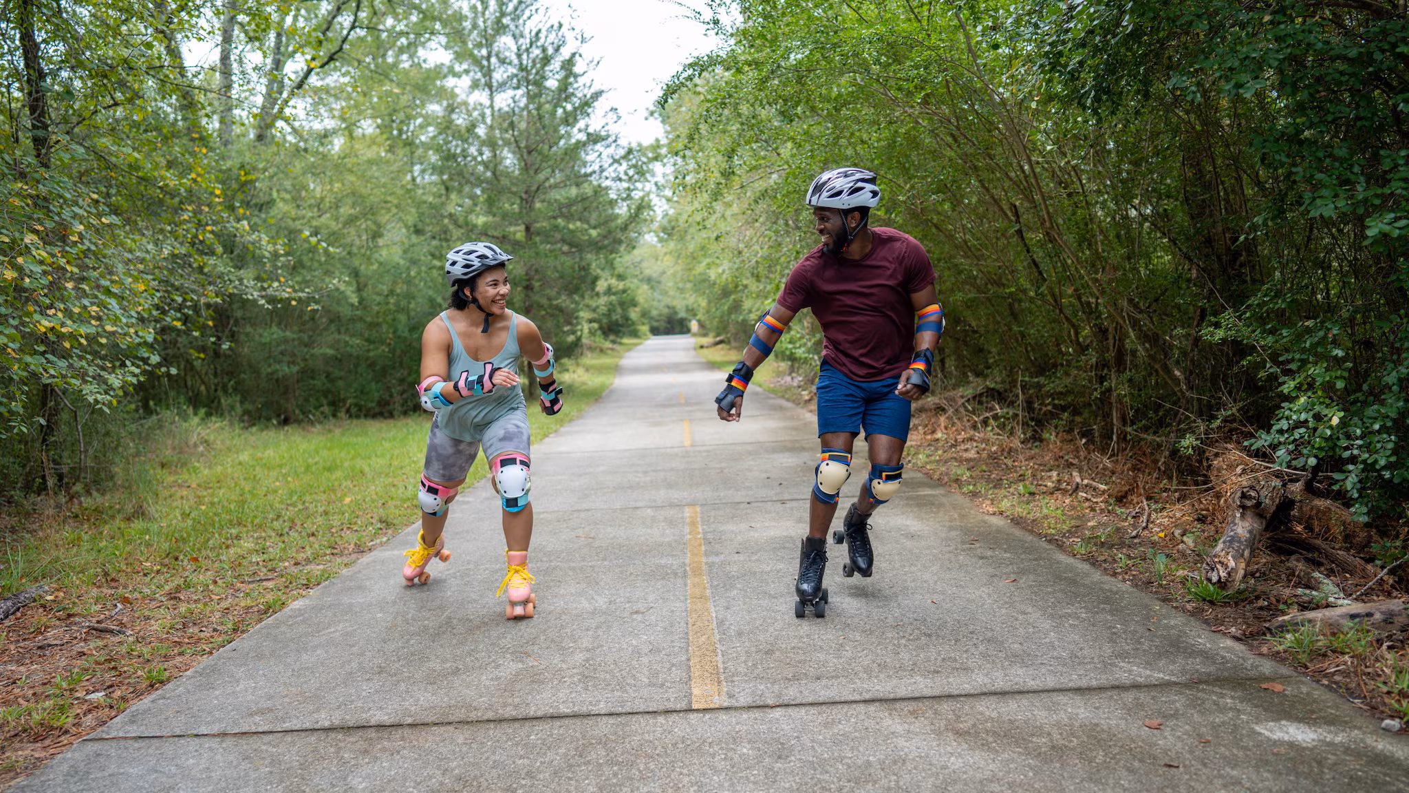 Two people roller skating.