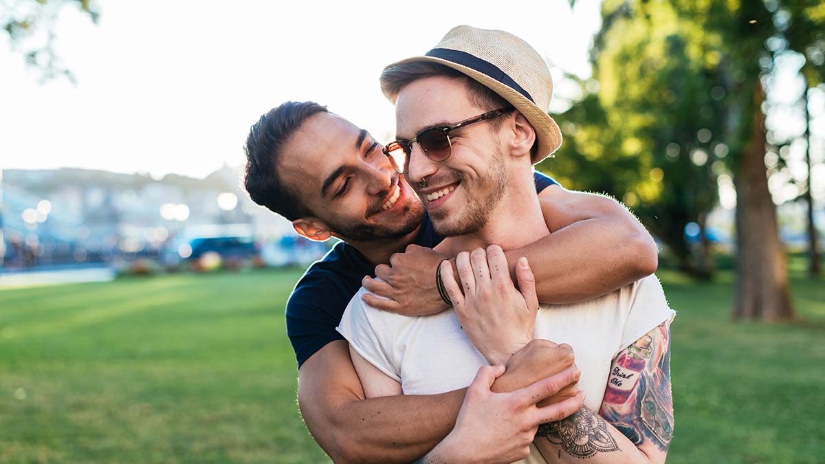 Vaccination Against Hepatitis A and B for Gay and Bisexual Men Two men hugging that are vaccinated against hepatitis A and hepatitis B
