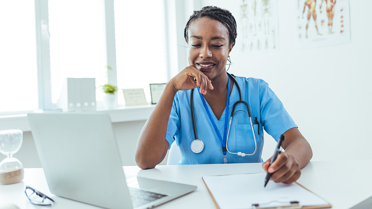 Recommendations for Hepatitis B Screening and Testing Healthcare professional checking their laptop for hepatitis b screening and testing information