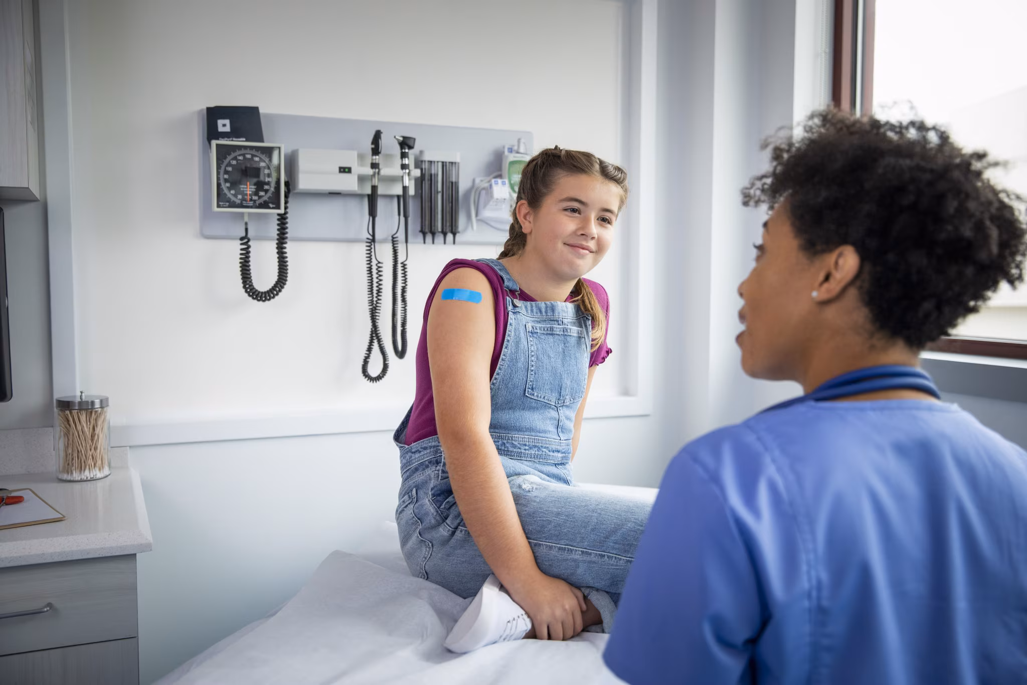 Patient talks to doctor about HPV vaccination.