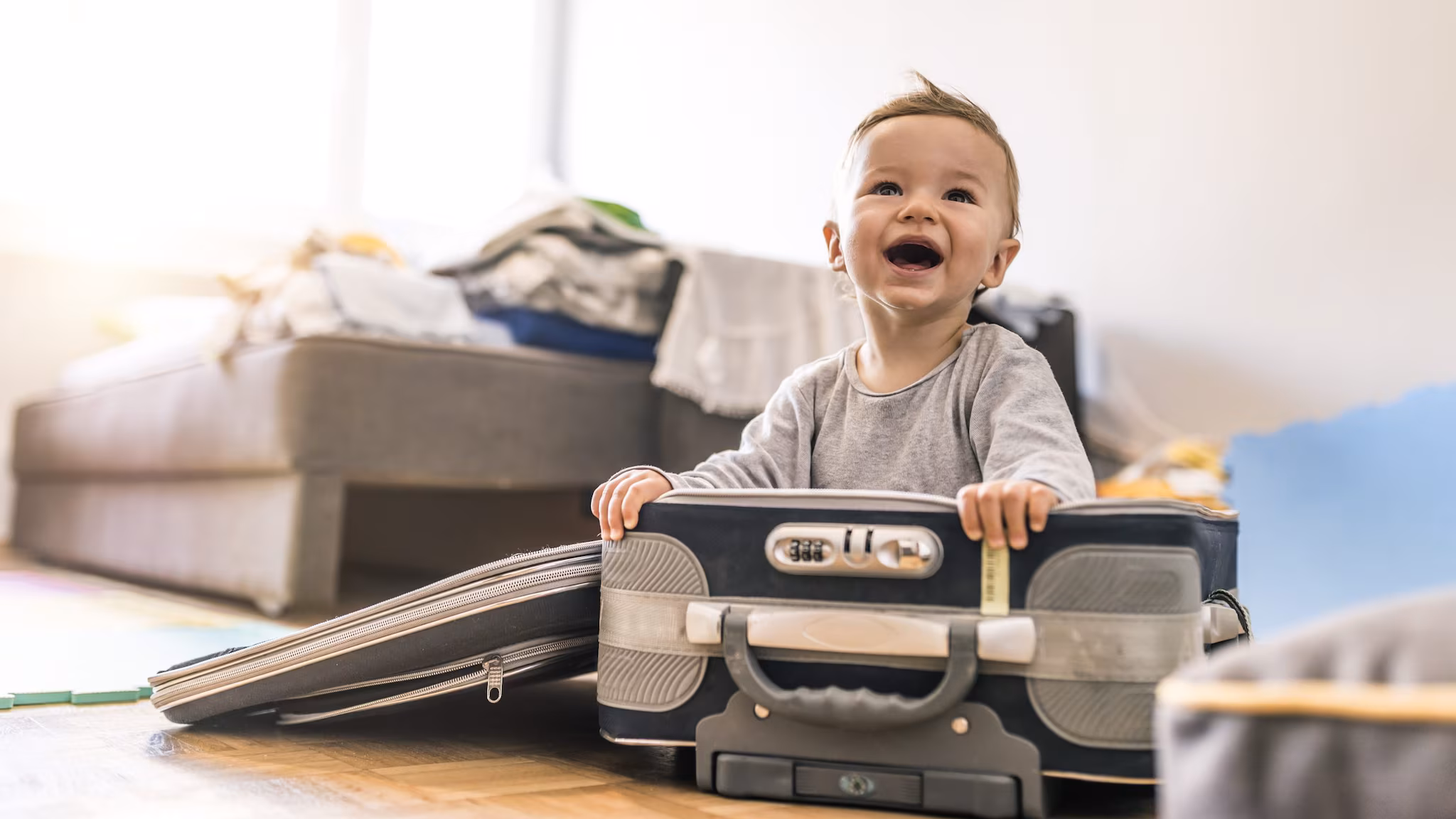 — title missing — Baby in a suitcase.