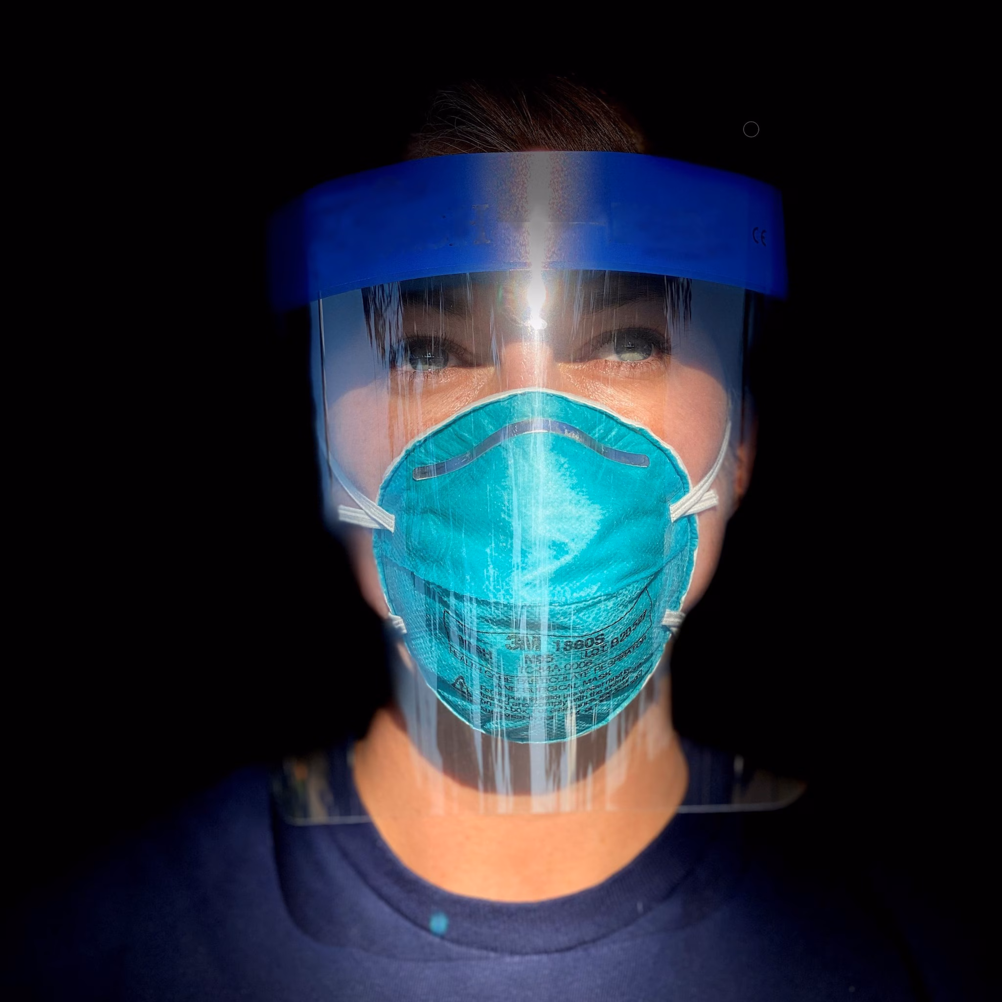 A laboratory scientist during CDC's COVID-19 response wearing a mask and face shield.