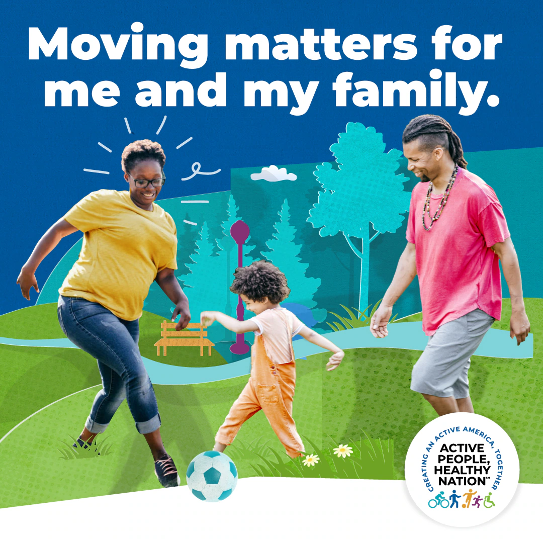 Family playing soccer