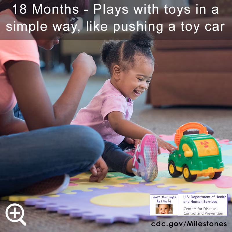 Plays with toys in a simple way, like pushing a toy car