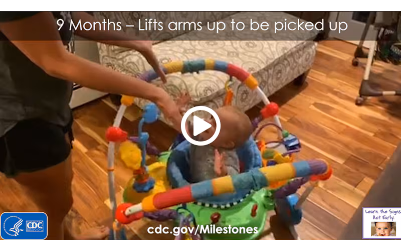 Lifts arms up to be picked up