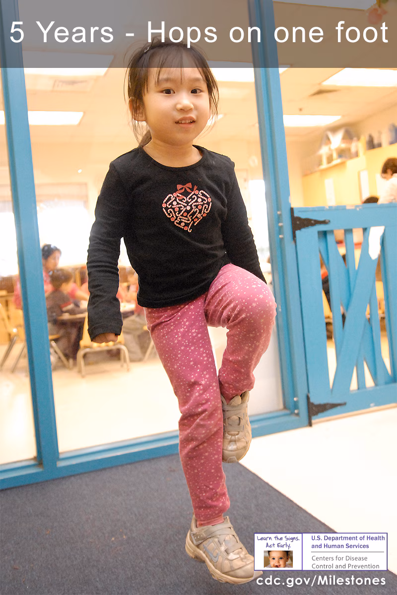The child in this photo is hopping on one foot, a 5-year movement/physical development milestone.