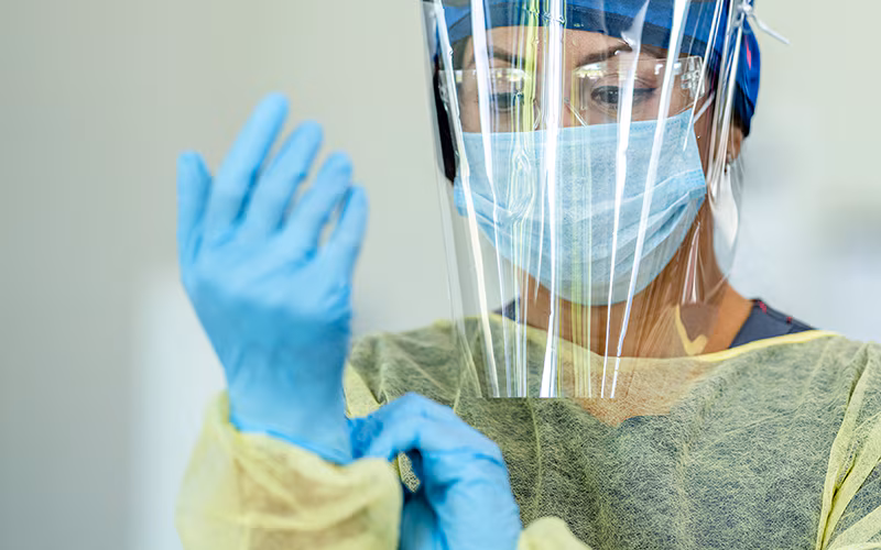 Hispanic female medical professional in Personal Protective Equipment