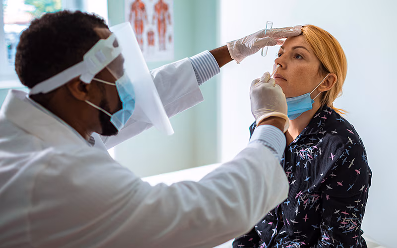 Young woman having a nasal swab test
