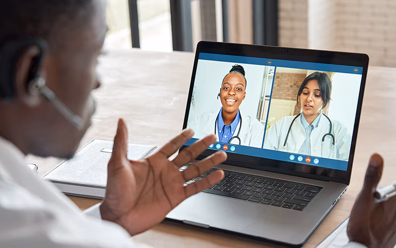 Multicultural doctors team conferencing in video call chat