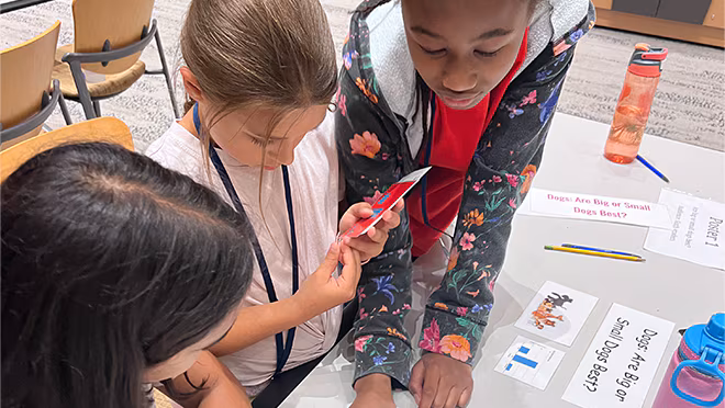 Students organizing a visual presentation.