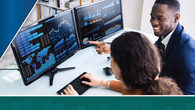 Two colleagues in an office sit at a computer and view data figures on two monitors with green data bar overlay