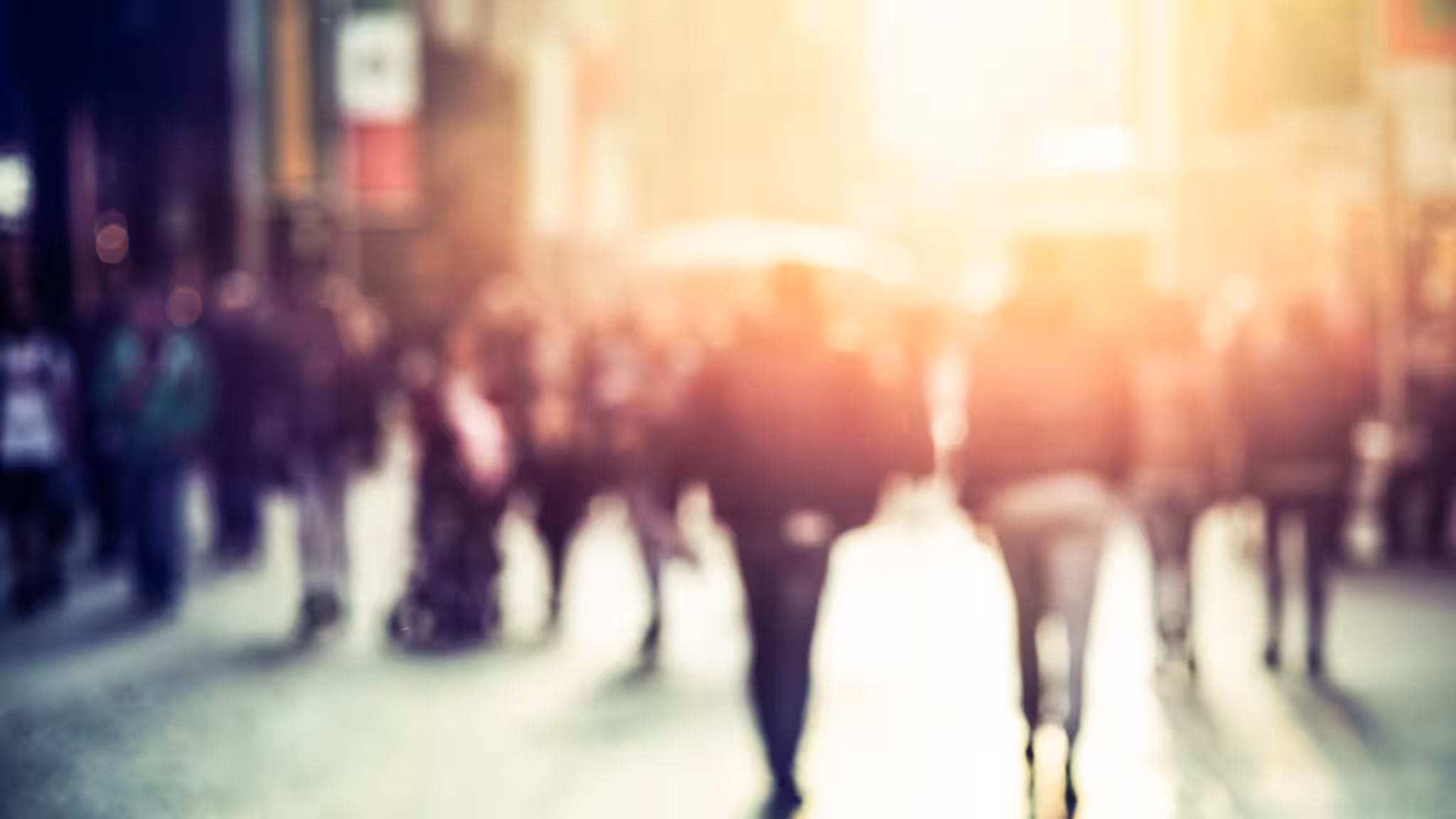 — title missing — People walking down a city street.