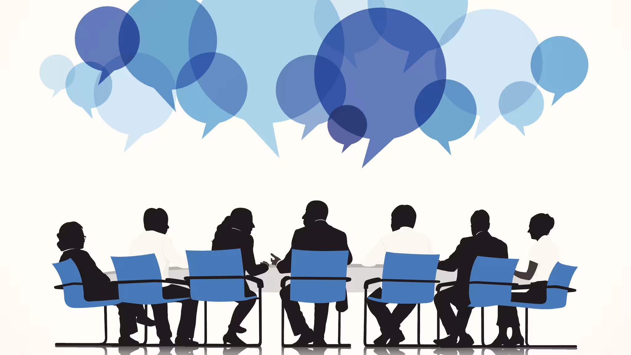 Silhouettes of people sitting at a conference table with speech bubbles above.