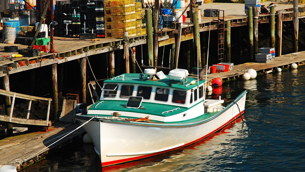 Commercial lobster boat A commercial lobster boat is docked on the coast of Portsmouth, New Hampshire. Image by Images