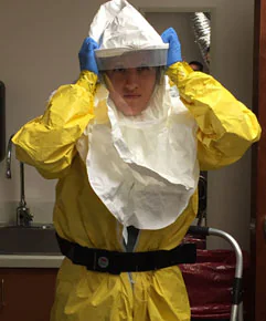 NurseDemo Nurse demonstrating the donning of PPE worn by healthcare providers when treating an Ebola patient in a medical intensive care unit (ICU)