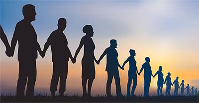 PeopleHoldingHands Line of people holding hands silhouetted against the sky