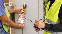 Two men engaging in a LOTO audit