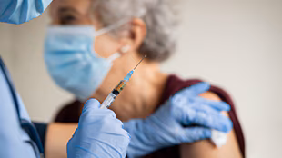 Senior woman getting vaccinated