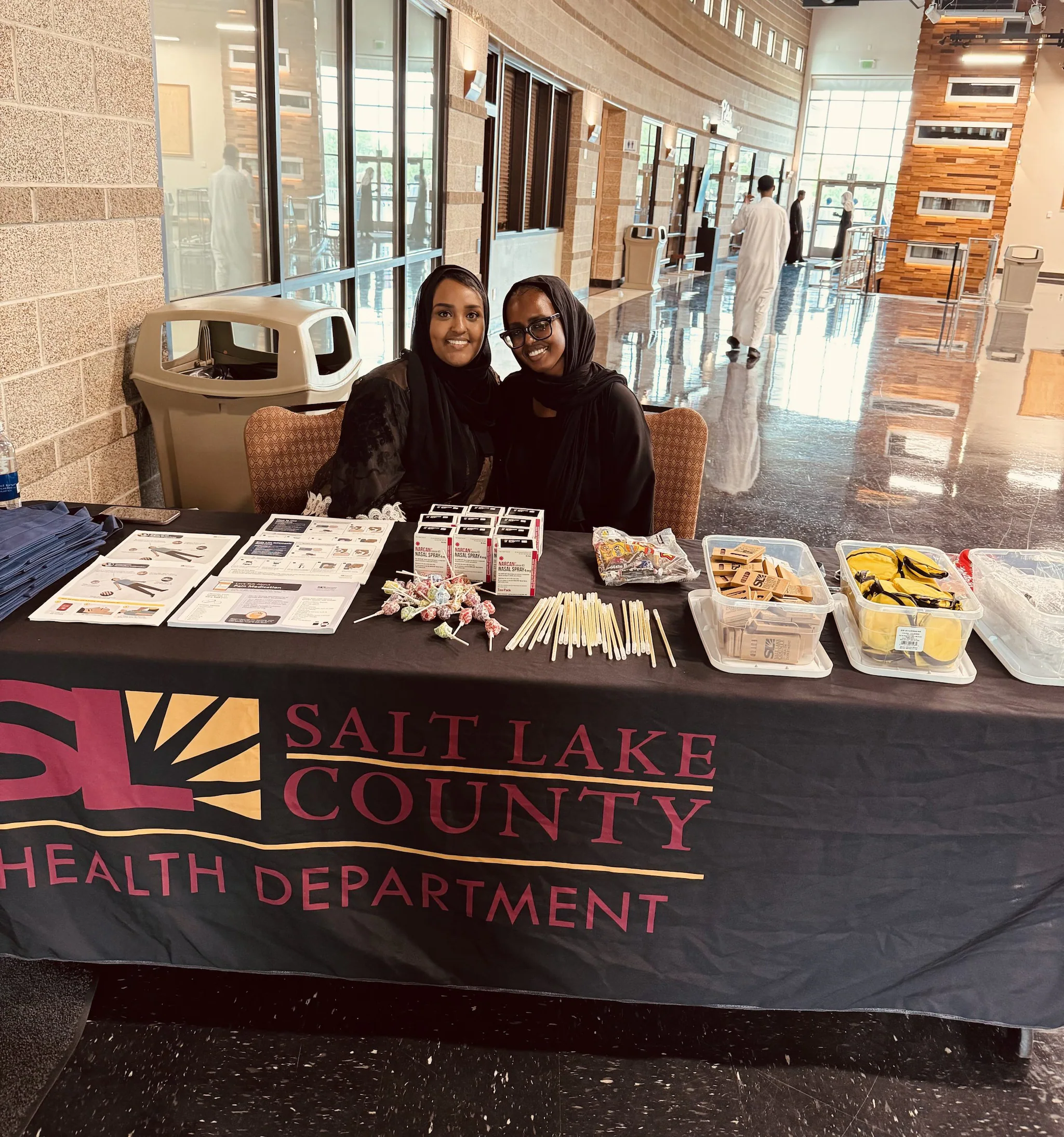 OD2A-Stories-SaltLakeCounty Ayan (left) and Halima (right) tabling at a graduation event for Somali residents completing their Koran study courses.
