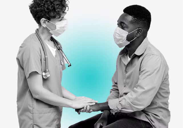 Patient and doctor talking.  Doctor is holding patient's hand demonstrating empathy.