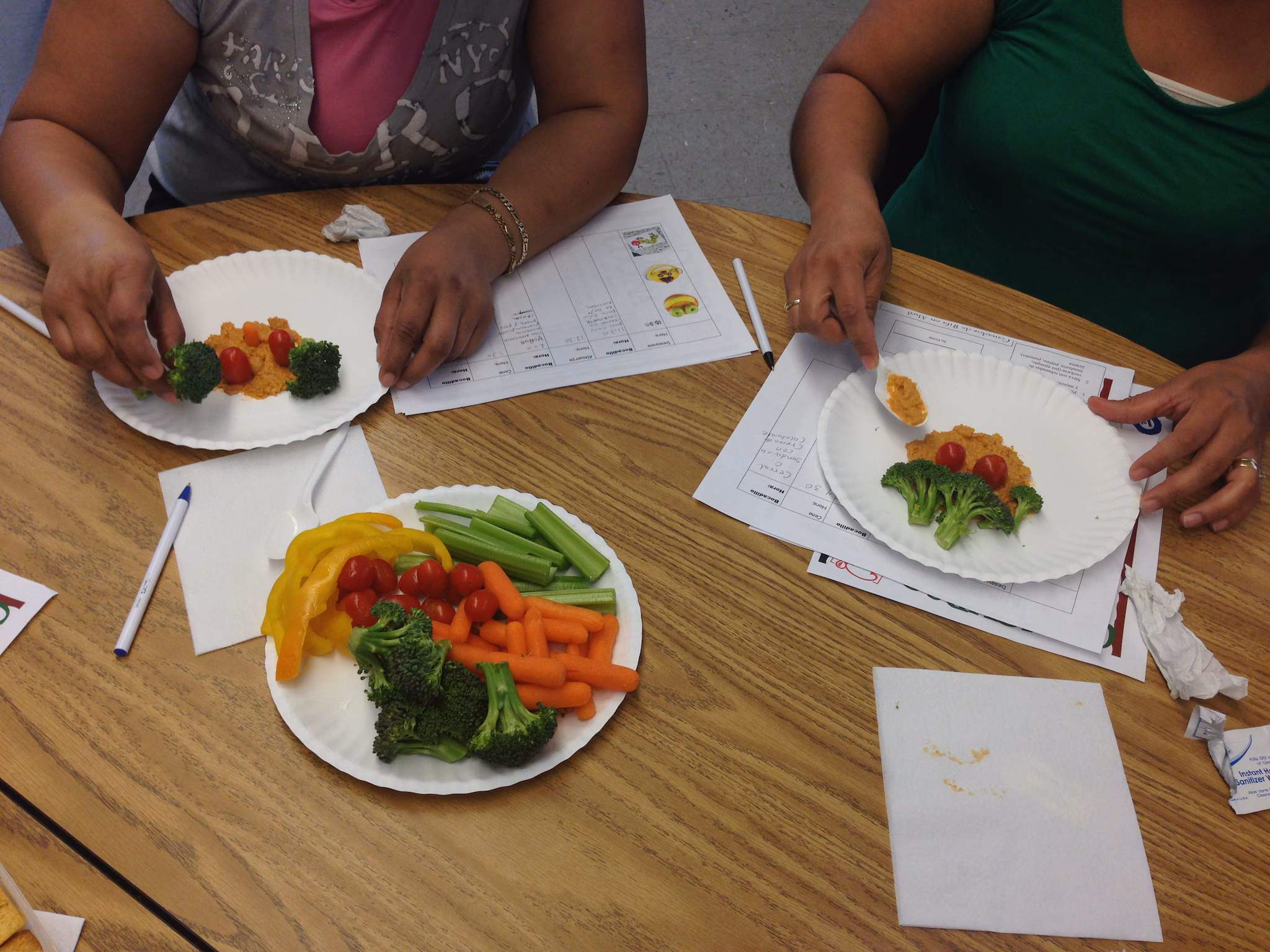 Photograph of a food-preparation activity from a culturally adapted nutrition education program for Mexican-origin families, California’s Central Valley, 2012–2013 Photograph of a food-preparation activity from a culturally adapted nutrition education program for Mexican-origin families, California’s Central Valley, 2012–2013