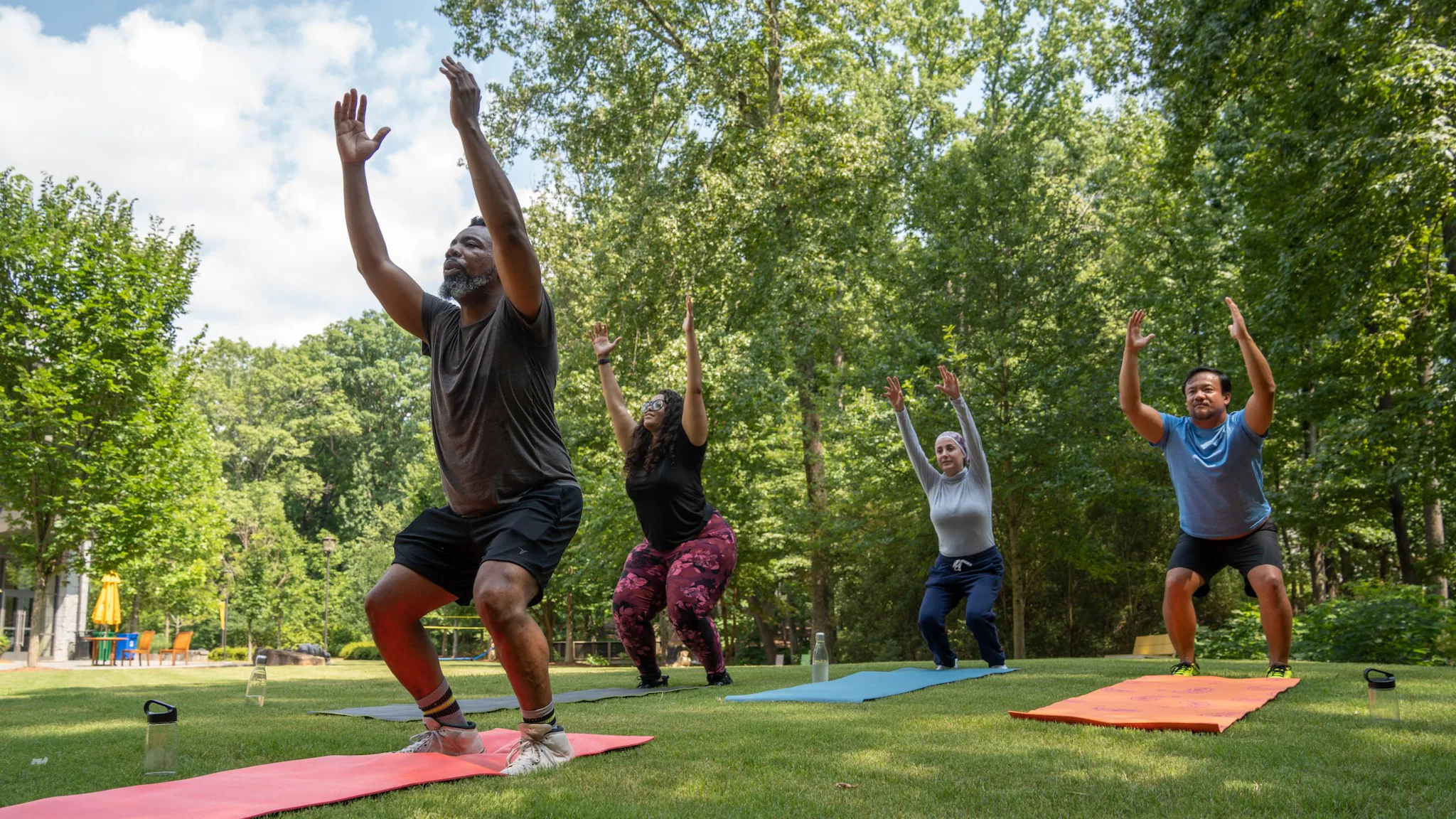 — title missing — People doing yoga in the park.
