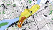 An arial view of a city map with colored circles and shapes indicating areas of blast/thermal damage and radiation exposure due to fallout.