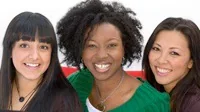 women faces of three women of diverse ethnicities together smiling