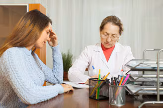 A school nurse meeting with high school student. A school nurse meeting with high school student.