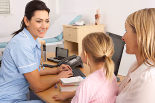 A nurse is meeting with a female adult and child.
