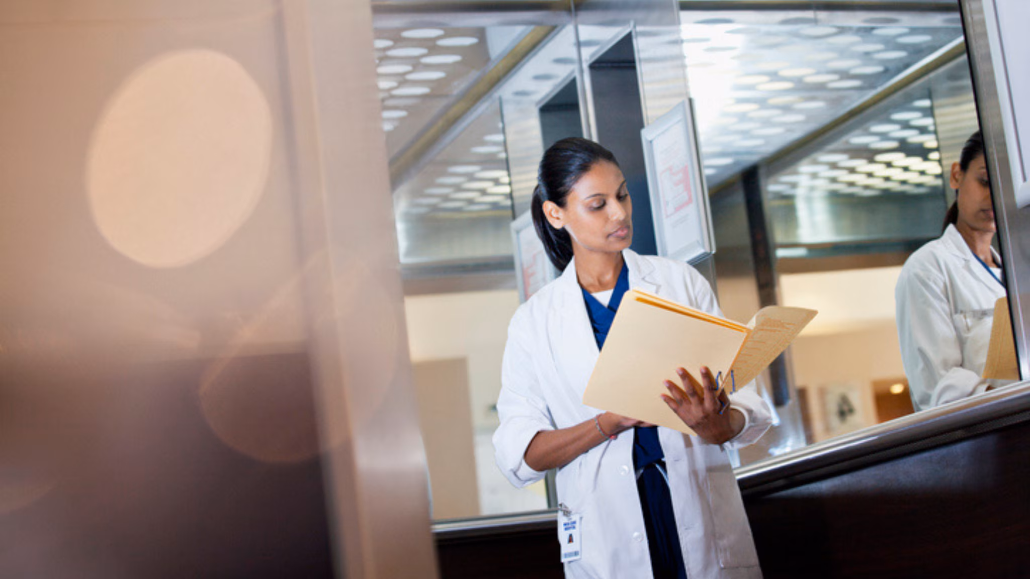 Doctor reading tablet
